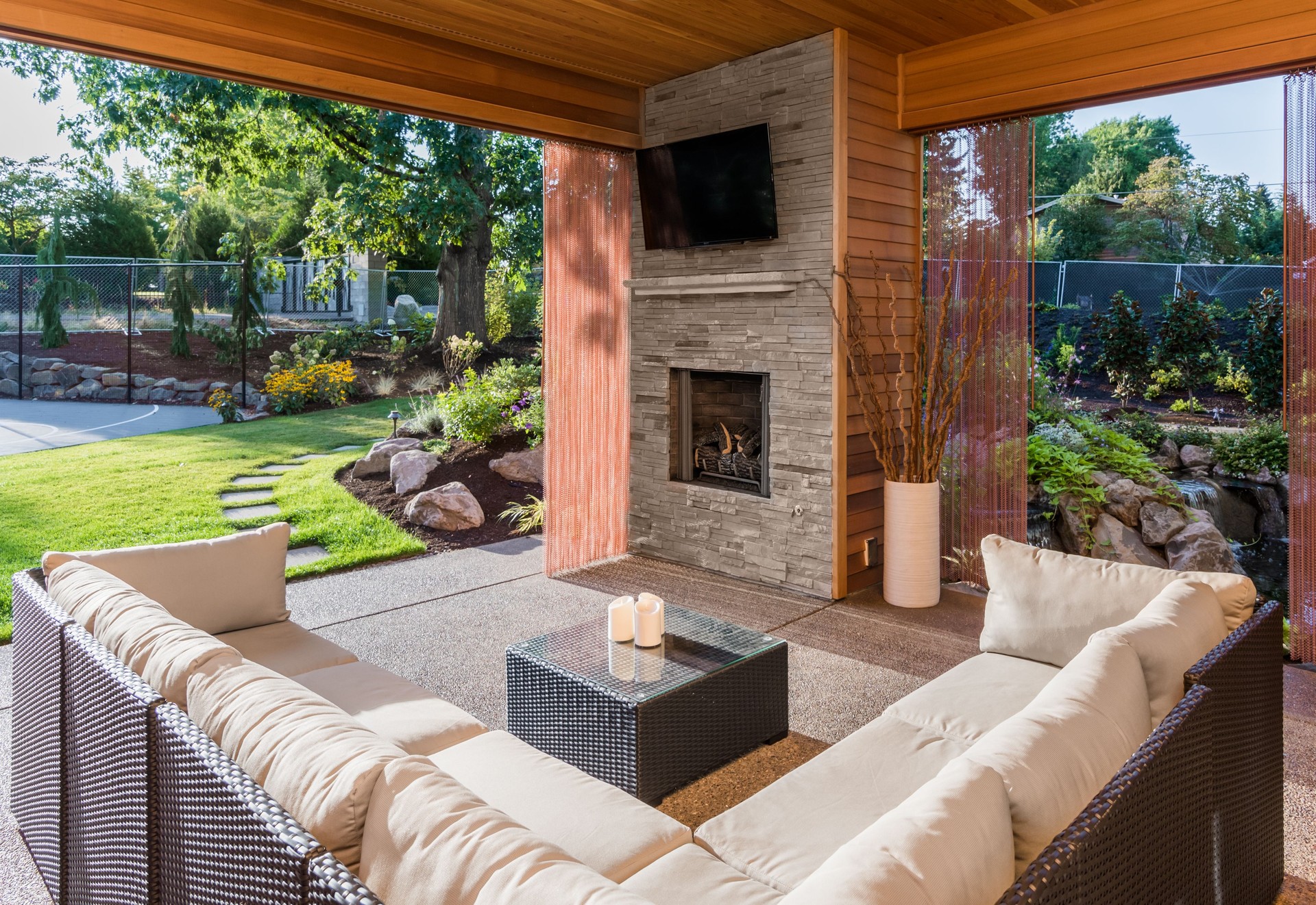 Covered patio exterior behind new luxury home